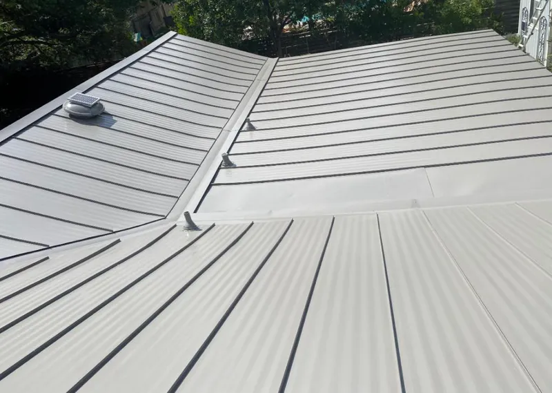 Solar attic fan installed on a metal roof for Roof Ventilation in Port LaBelle